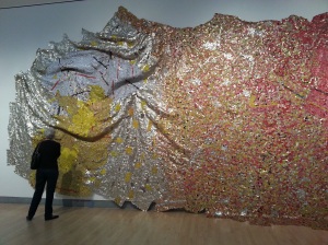 El Anatsui (Ghanaian, born 1944). Gravity and Grace (Partial View), 2010. Aluminum and copper wire, 145 5/8 x 441 in. (369.9 x 1120.1 cm)